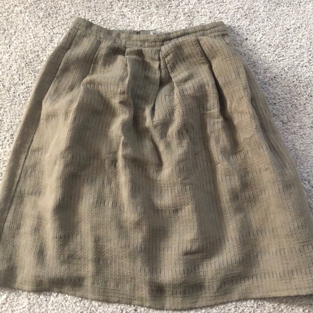Knee length dark green skirt from DE collection.